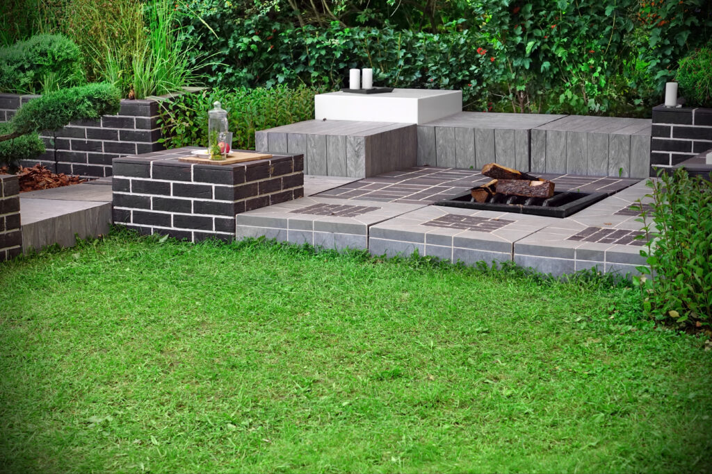 masonry outdoor fireplace with seating